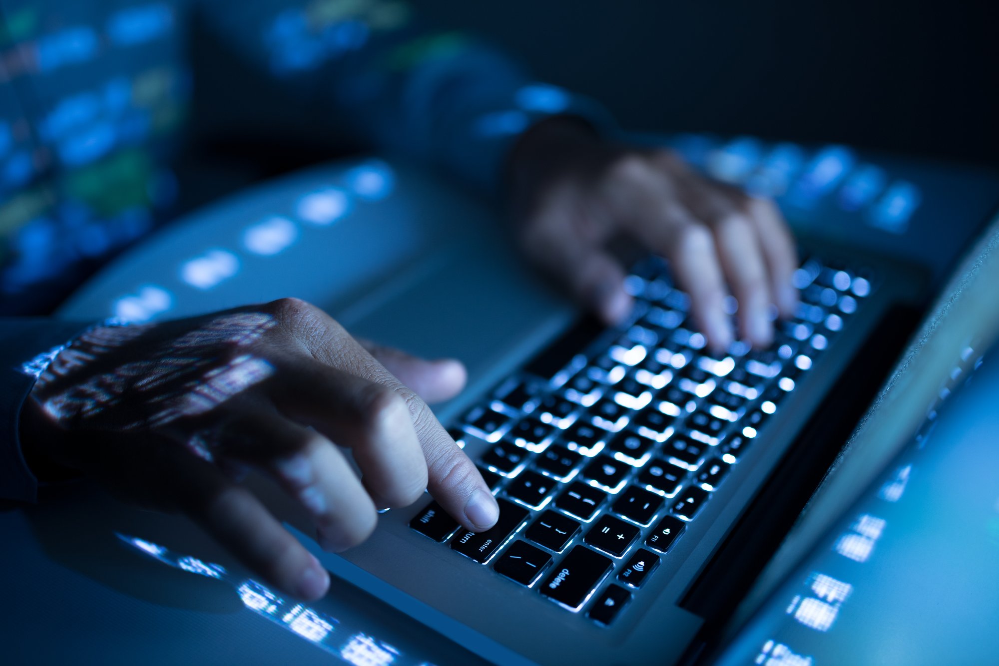 typing-on-laptop-keyboard-with-illuminated-keys-2026-03-18-14-53-48-utc
